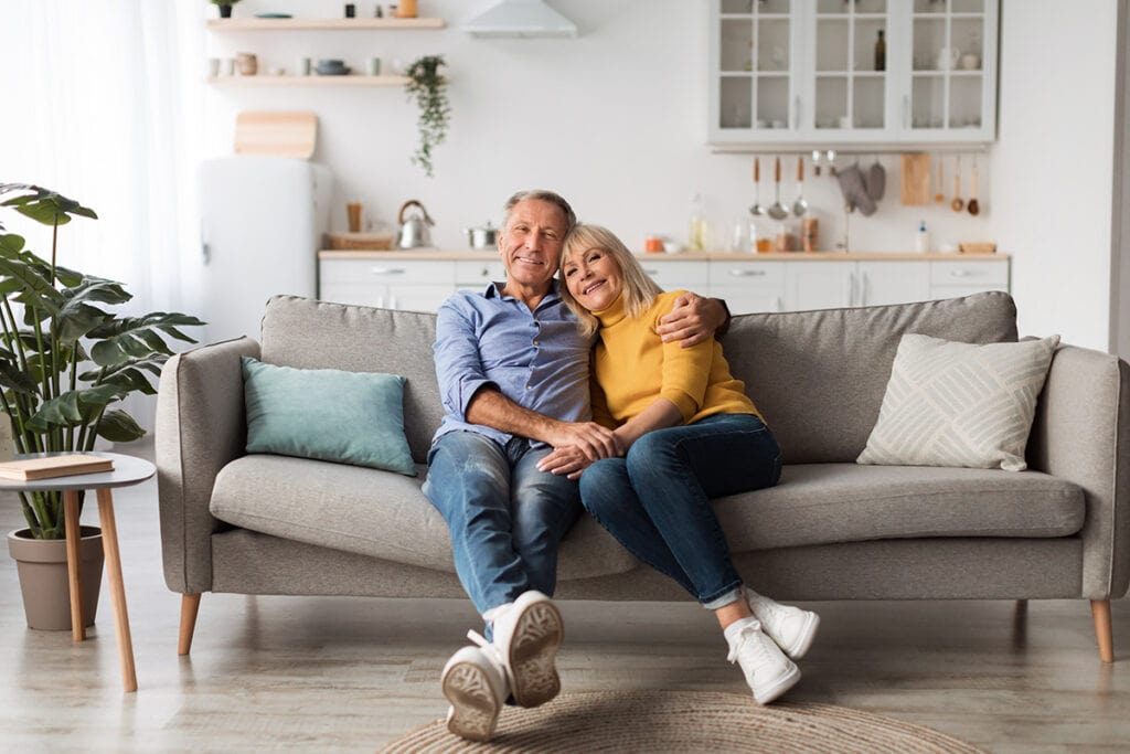 Happy senior couple enjoying retirement in their Oasis Communities home